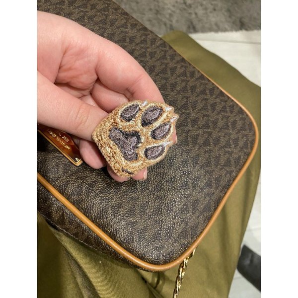 Miniature realistic design of a brooch, keychain or patch «Dog paw» in 3 colors